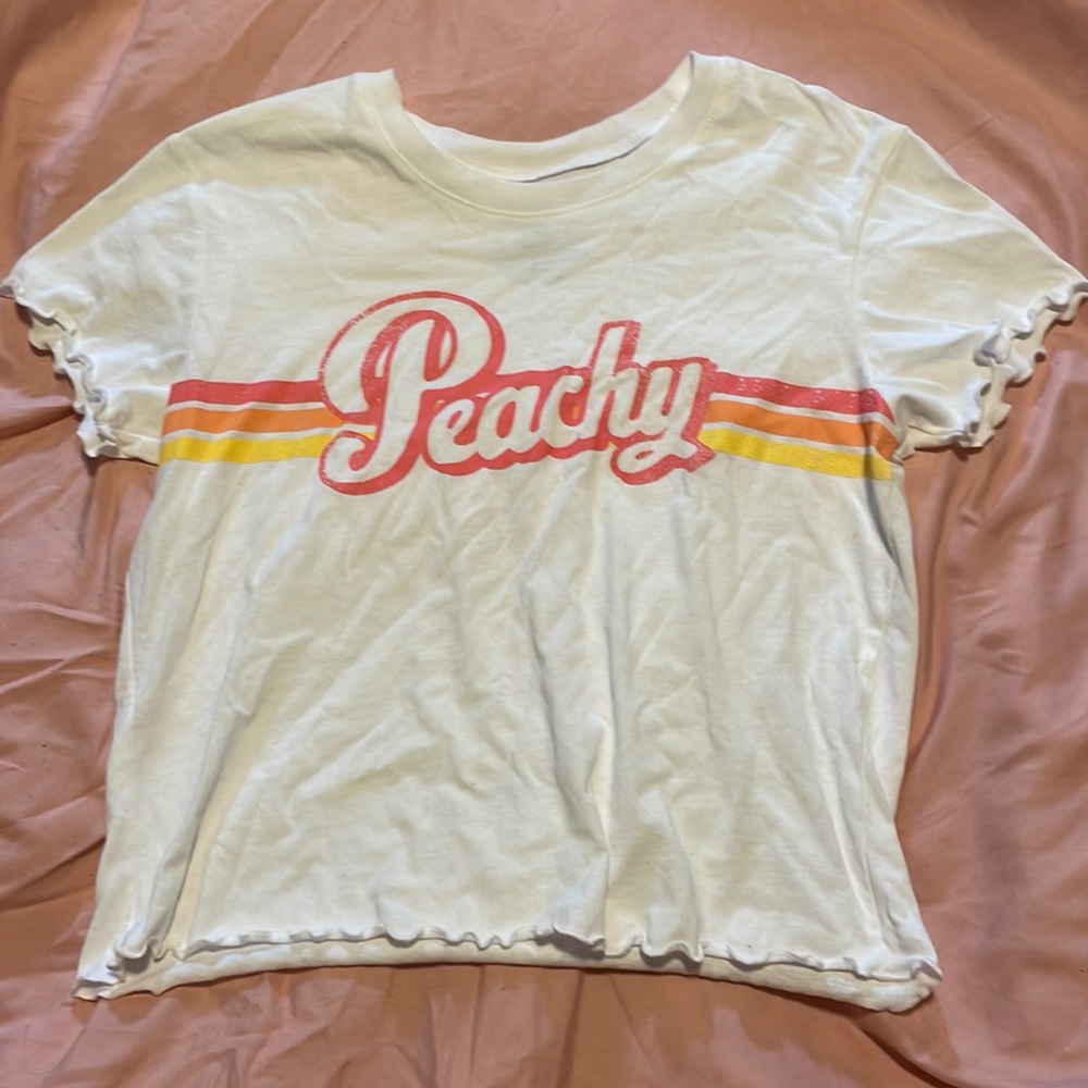 “Peachy” ruffled edges. Nothing on back